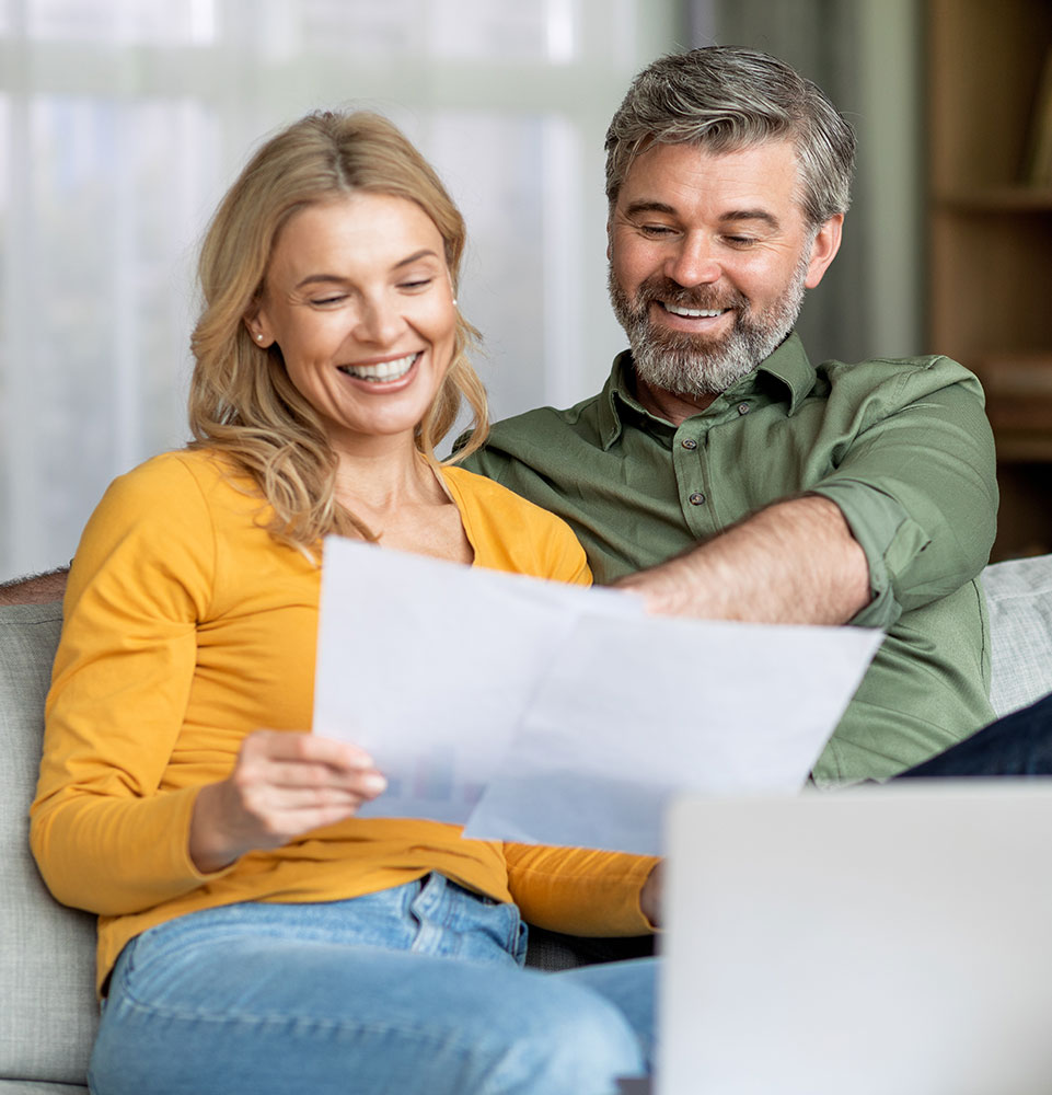 couple pricing out dental implant options