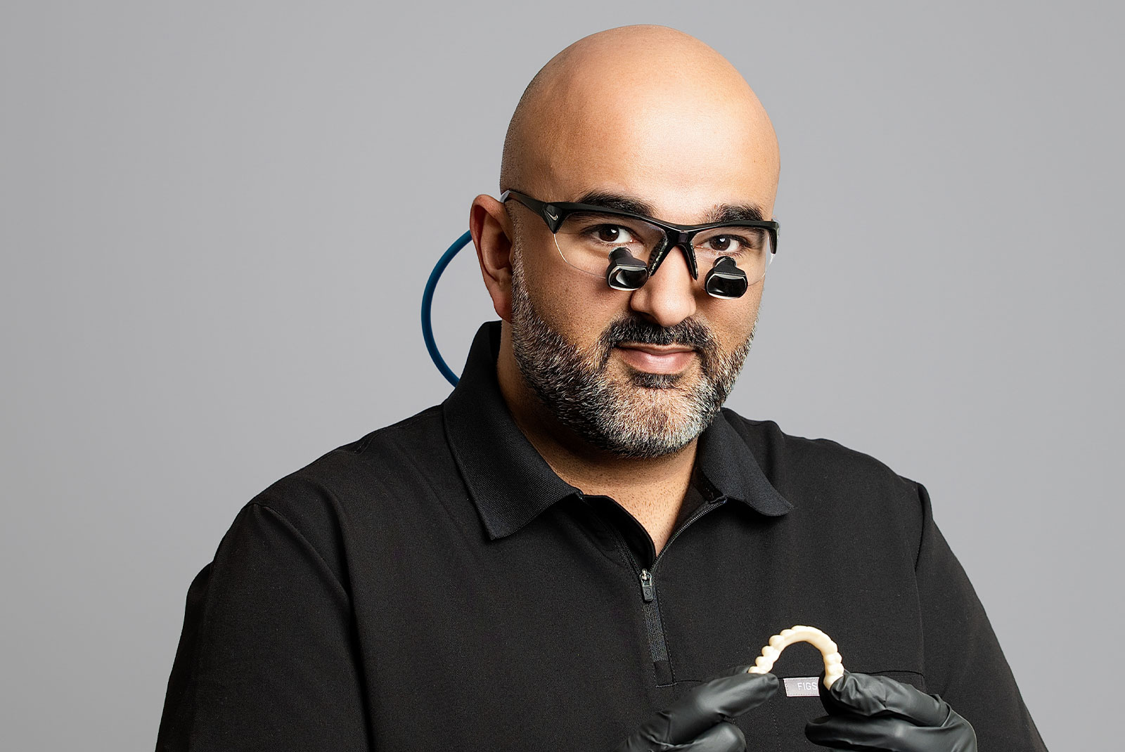 dr beniwal with classes and full arch