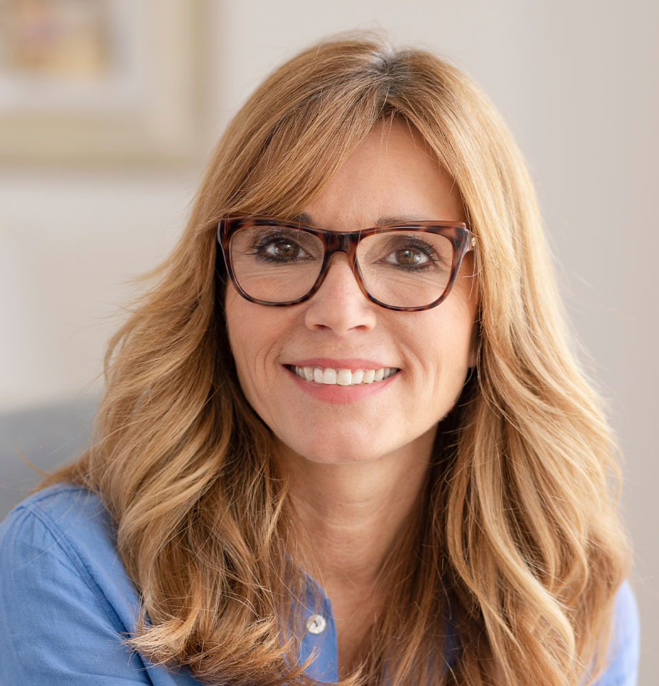 lady with her new full mouth dental implants hero mobile