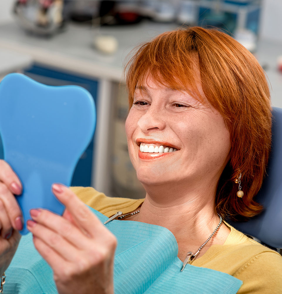 lady smiling after dental implants
