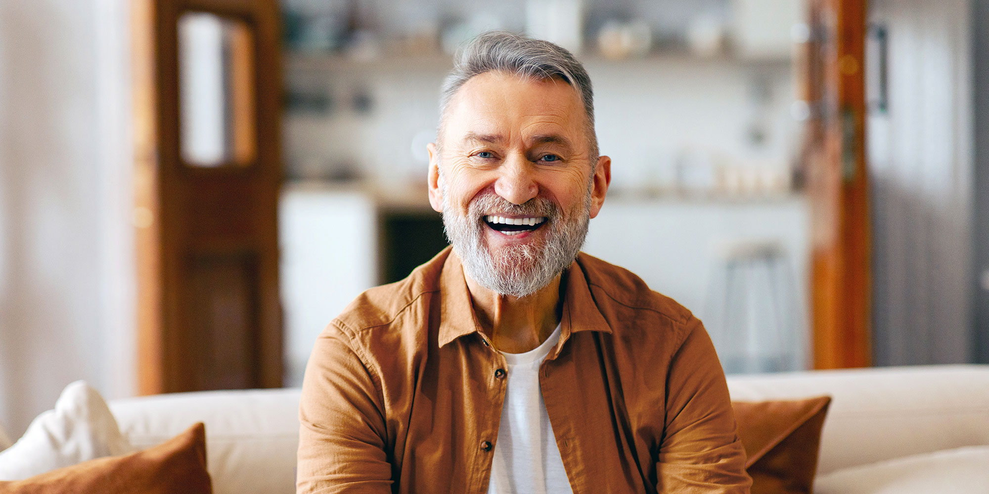 man with his new smile after dental implants