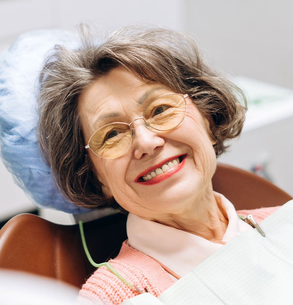 older lady before oral surgery dental implants hero mobile