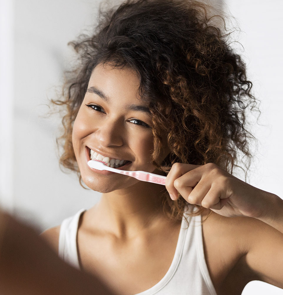 person brushing teeth well