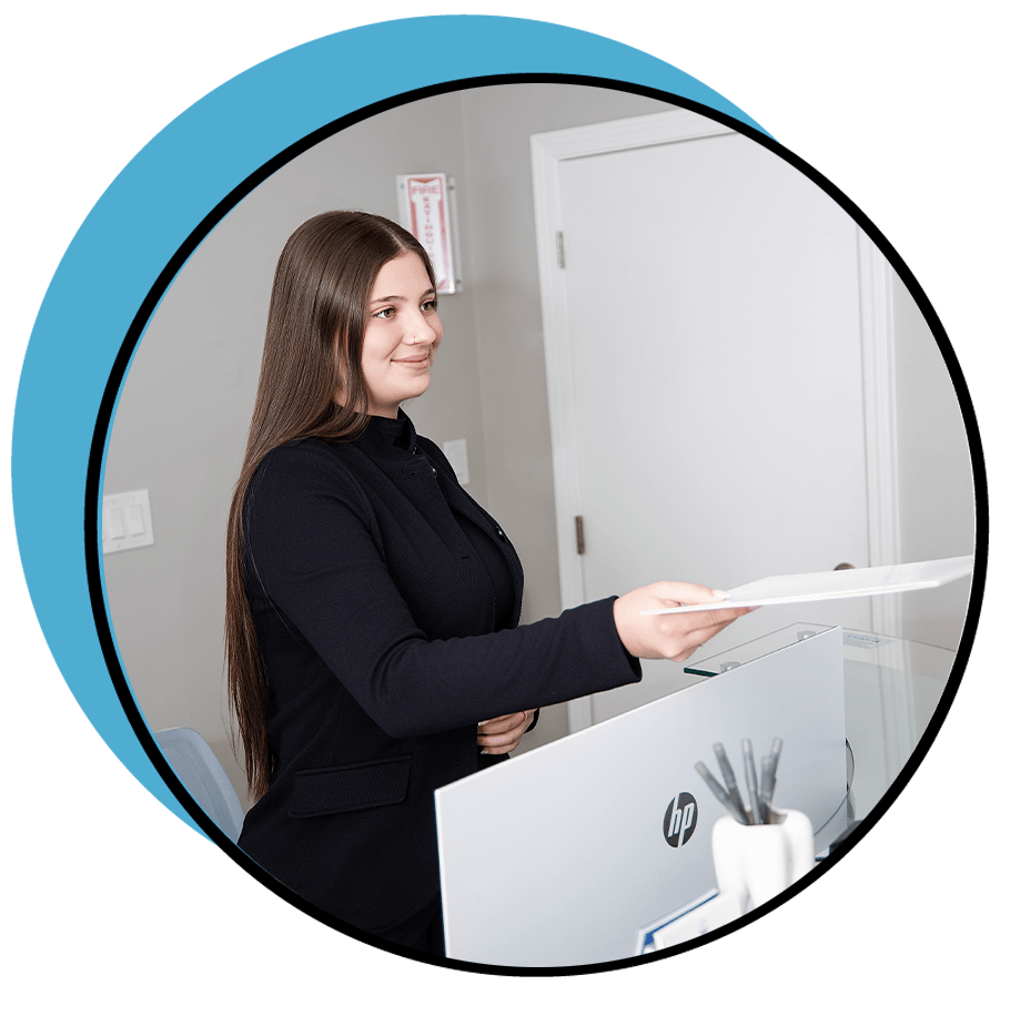 person handing patient paperwork