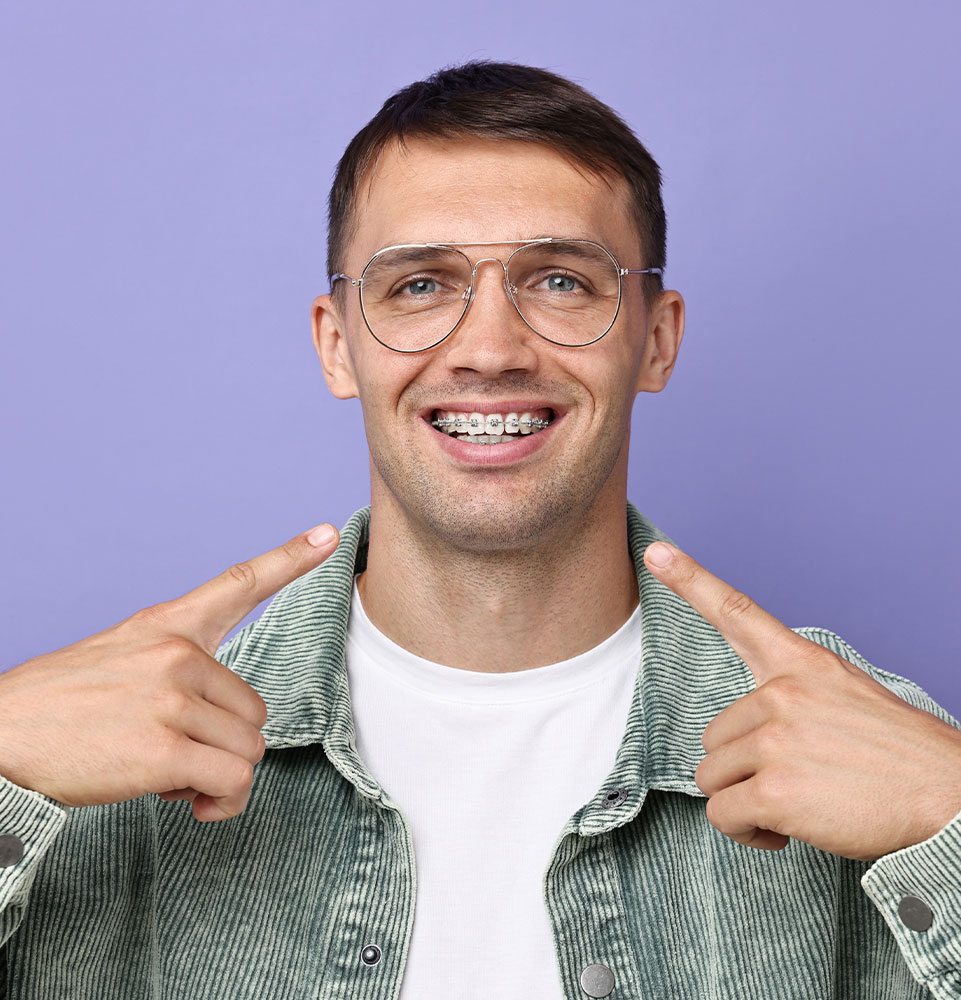 young man showing his braces